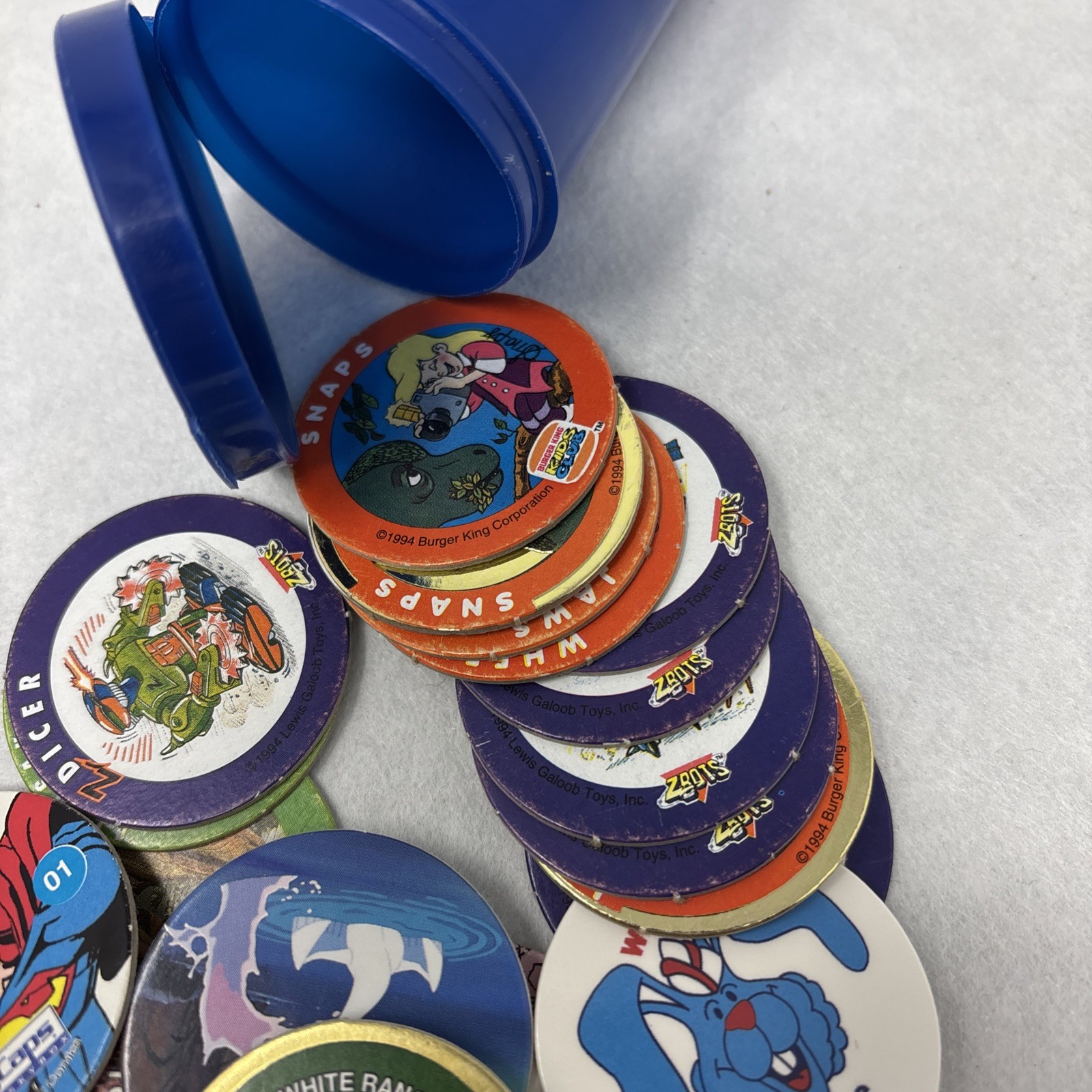 Vintage Pogs Lot Various 1990s Power Rangers, Jurassic Park, DC Comics w/ Tube