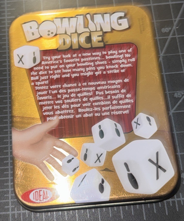 IDEAL Bowling Dice Game – 10 Dice & Score Pad in Tin Container – 2013