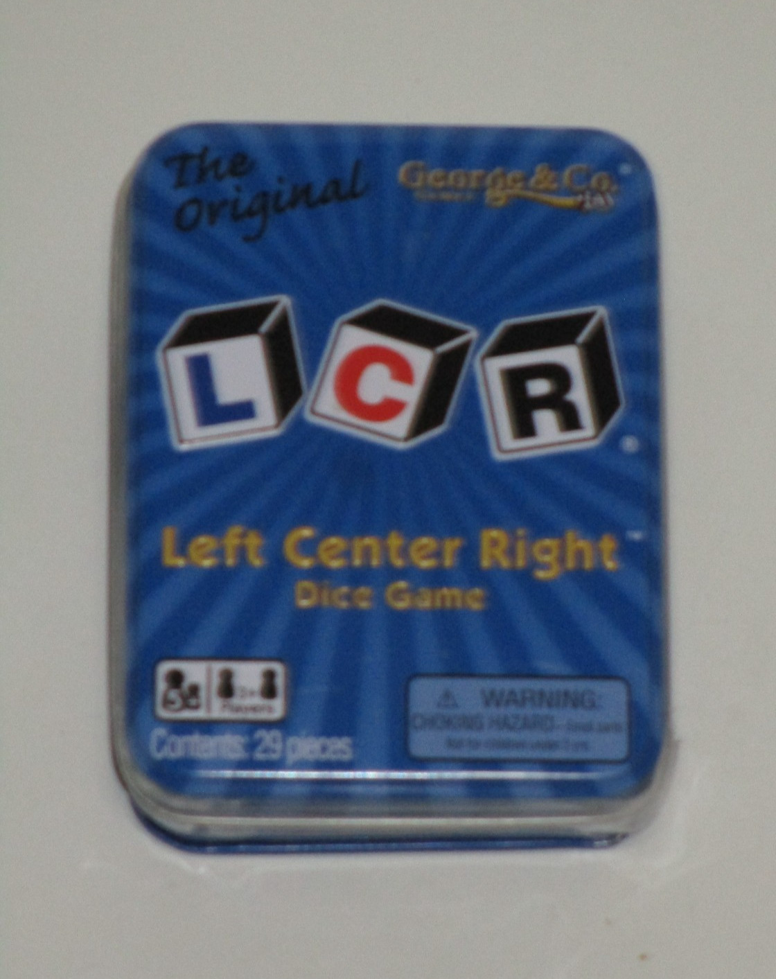LCR® Left Center Right™ Dice Game – Blue Tin
