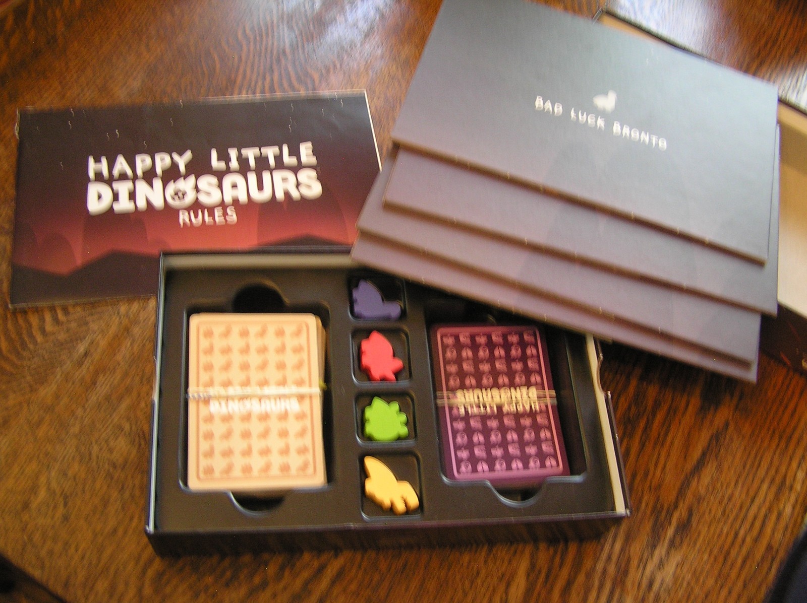 2021 Unstable Games HAPPY LITTLE DINOSAURS 2-4 Players Age 8+ Dodge Disasters
