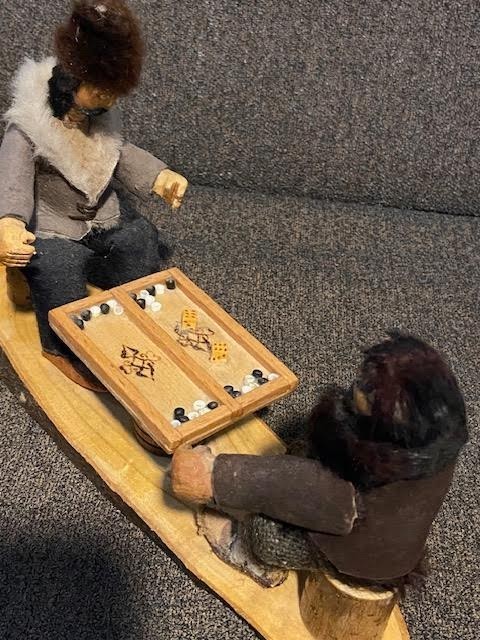 Handmade folk art wooden carved men playing backgammon vintage