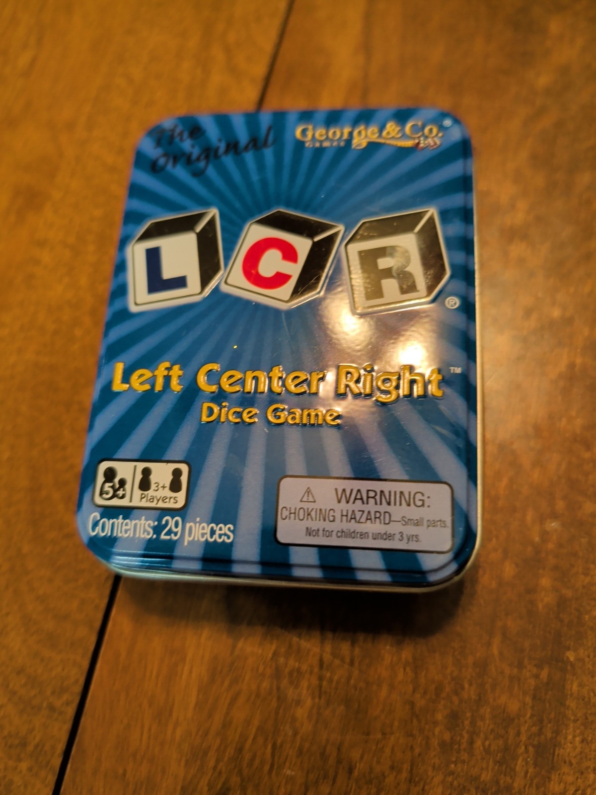 LCR® Left Center Right™ Dice Game – Blue Tin