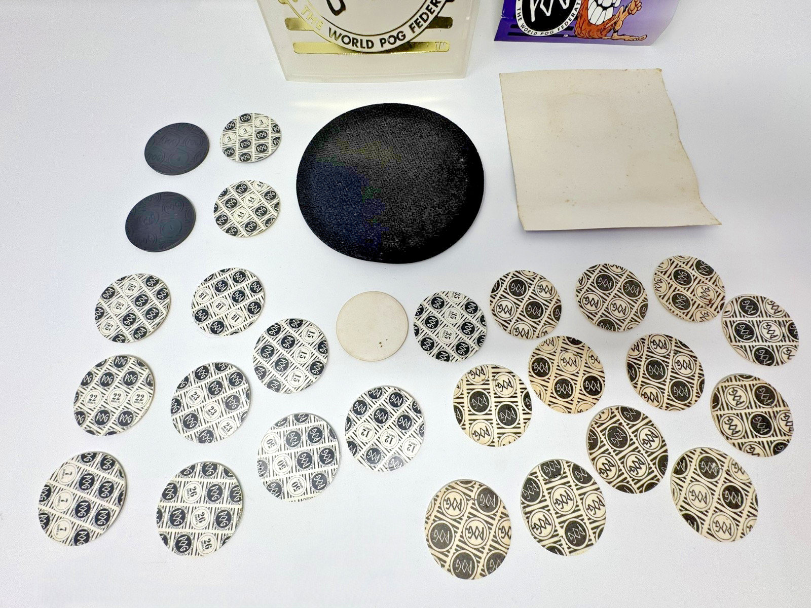 The World POG Federation Micro Tournament Game Pack with 2 Slammers & 25 Pogs