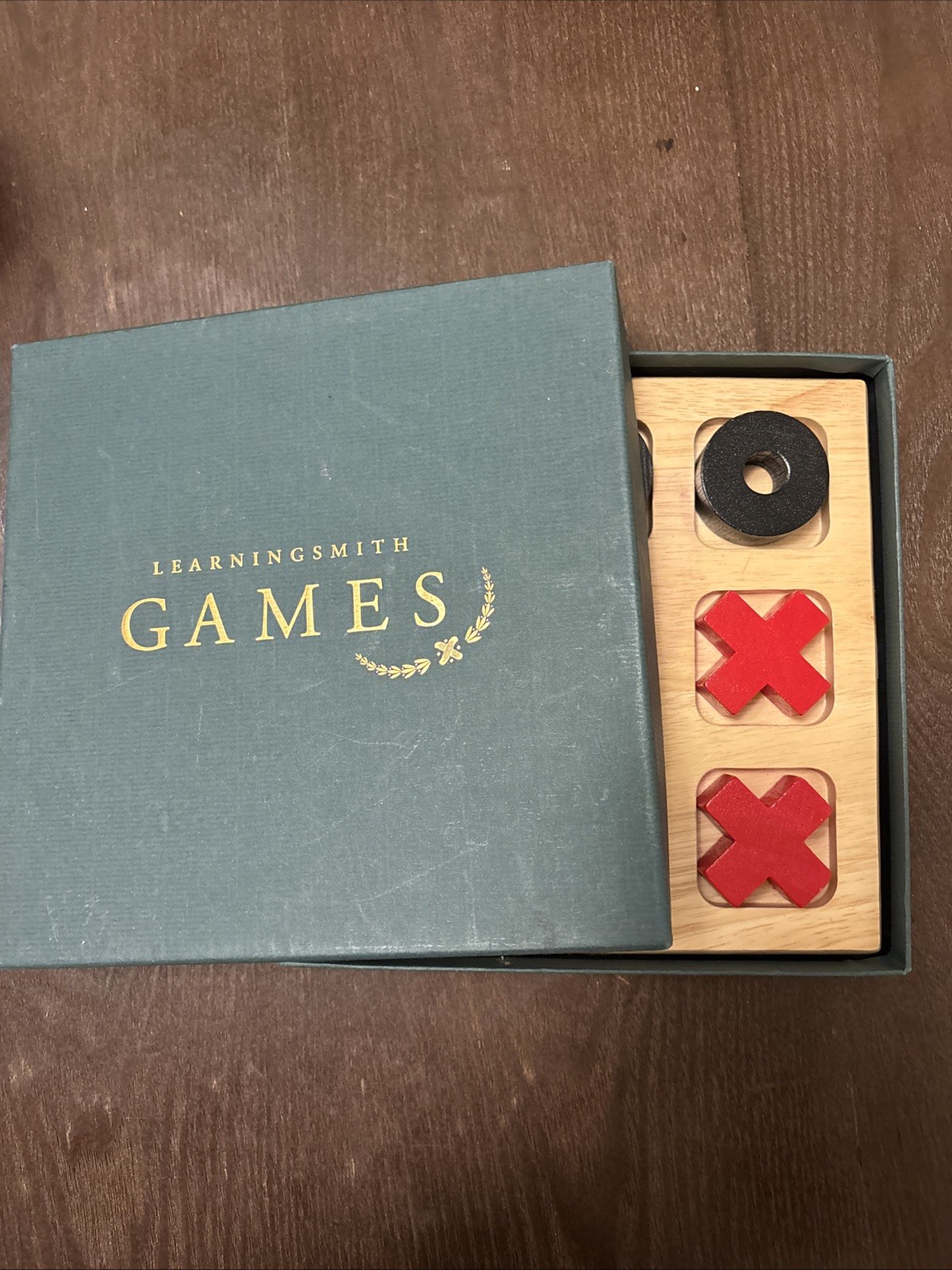 Learningsmith containing a tic-tac-toe game, 9-piece set