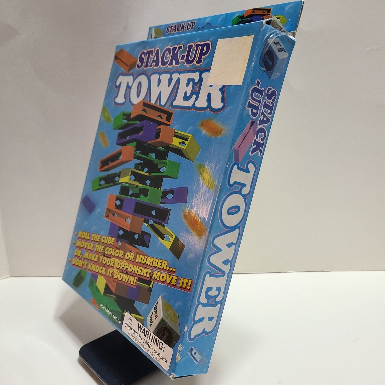 Stack Up Tower with 45 Colored Plastic Blocks and One Dice.