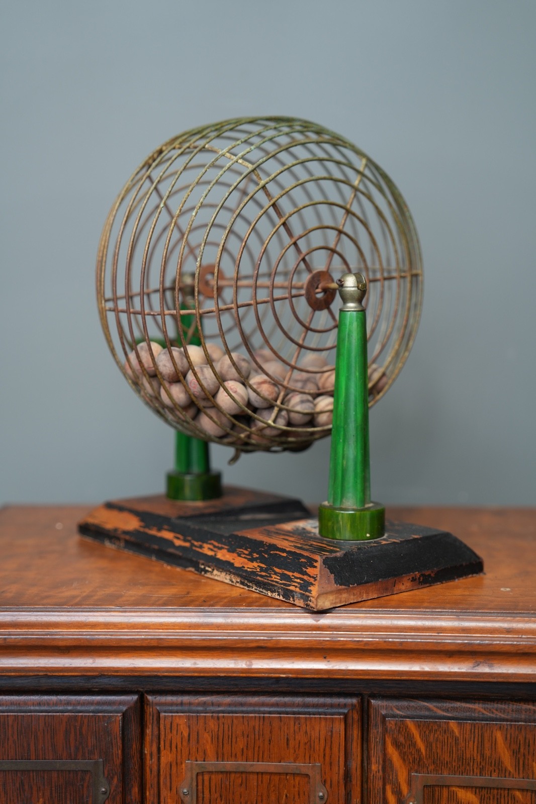 Vintage Metal Bingo Cage Green Bakelite Tower Pillars handle w/ wooden balls
