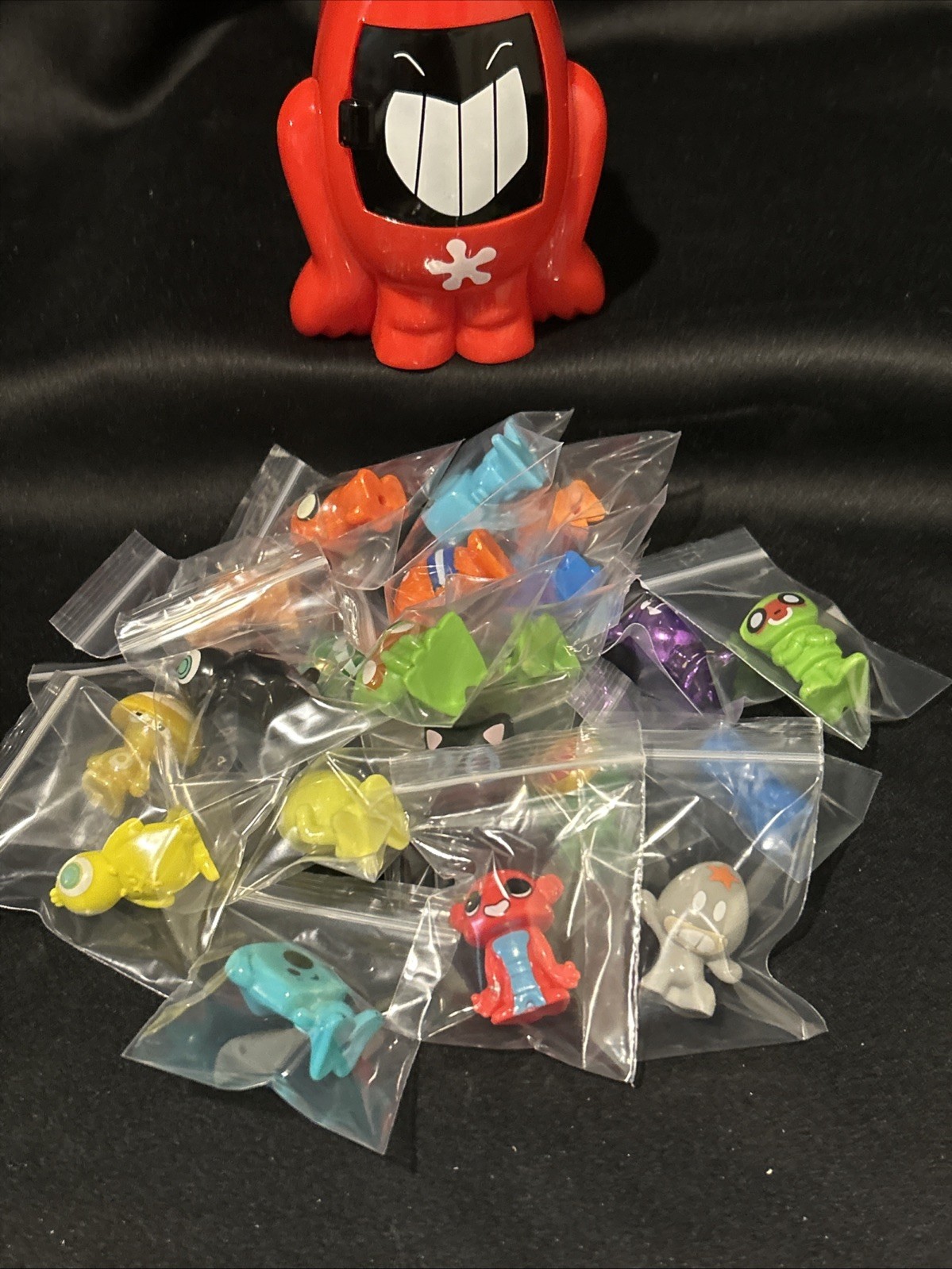 Lot Of 21 Gogo’s Crazy Bones Mini Figures Loose and Red Carrying Case