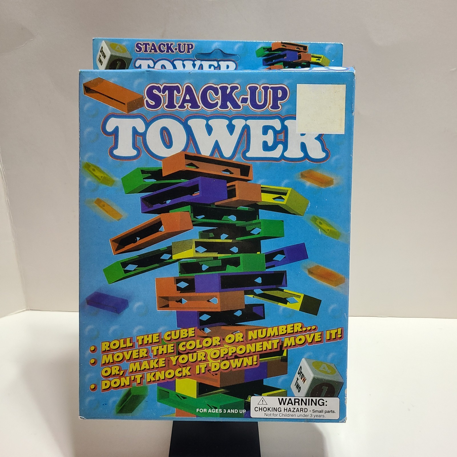 Stack Up Tower with 45 Colored Plastic Blocks and One Dice.